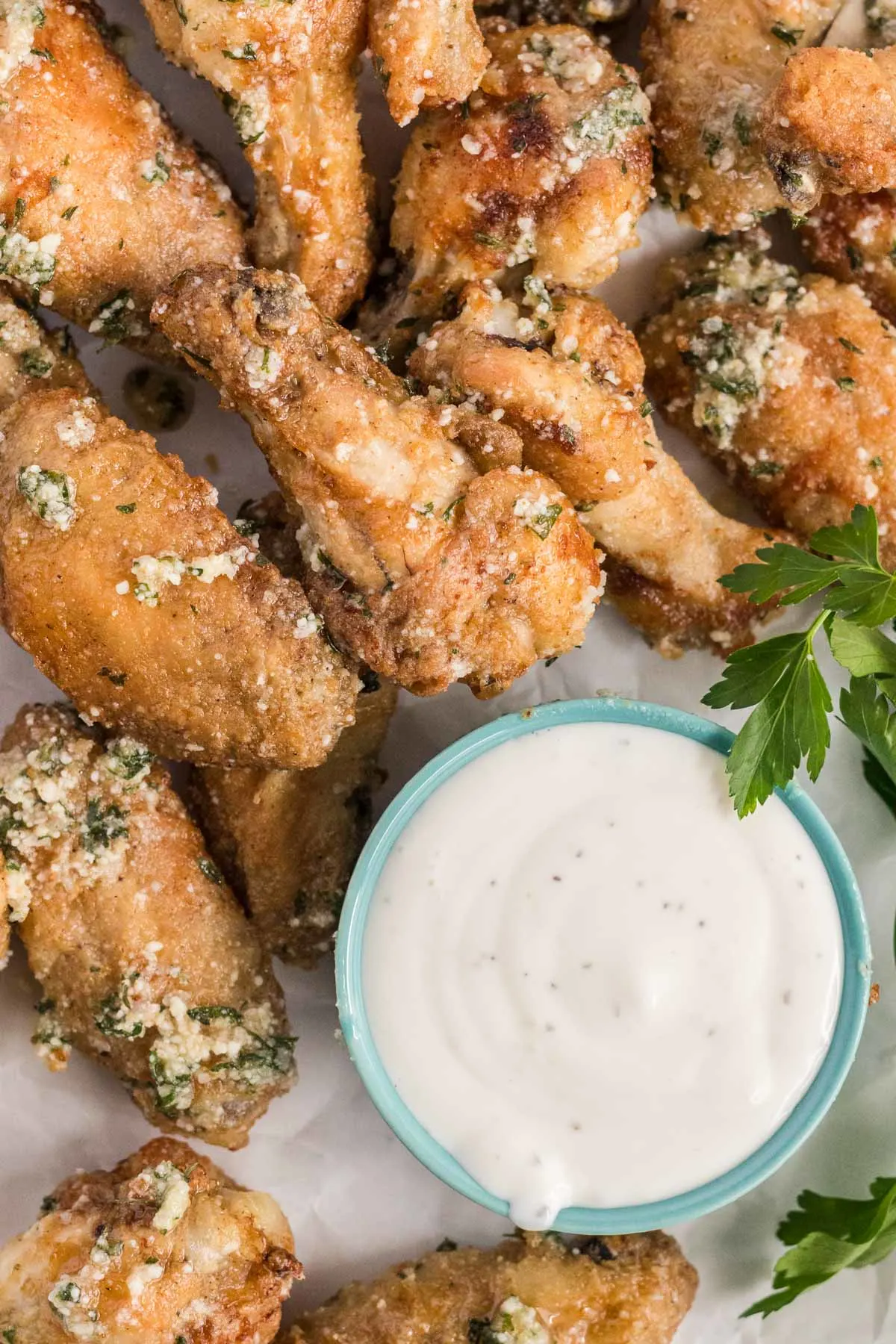 Platter of wings with ranch dipping sauce.