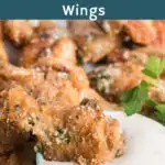 Wing dipped in a bowl of ranch dressing.