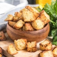 Croutons in a small wooden bowl.