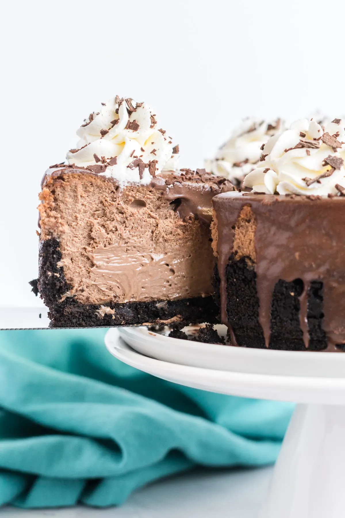 Slice being removed from a cheesecake using a pie lifter. 