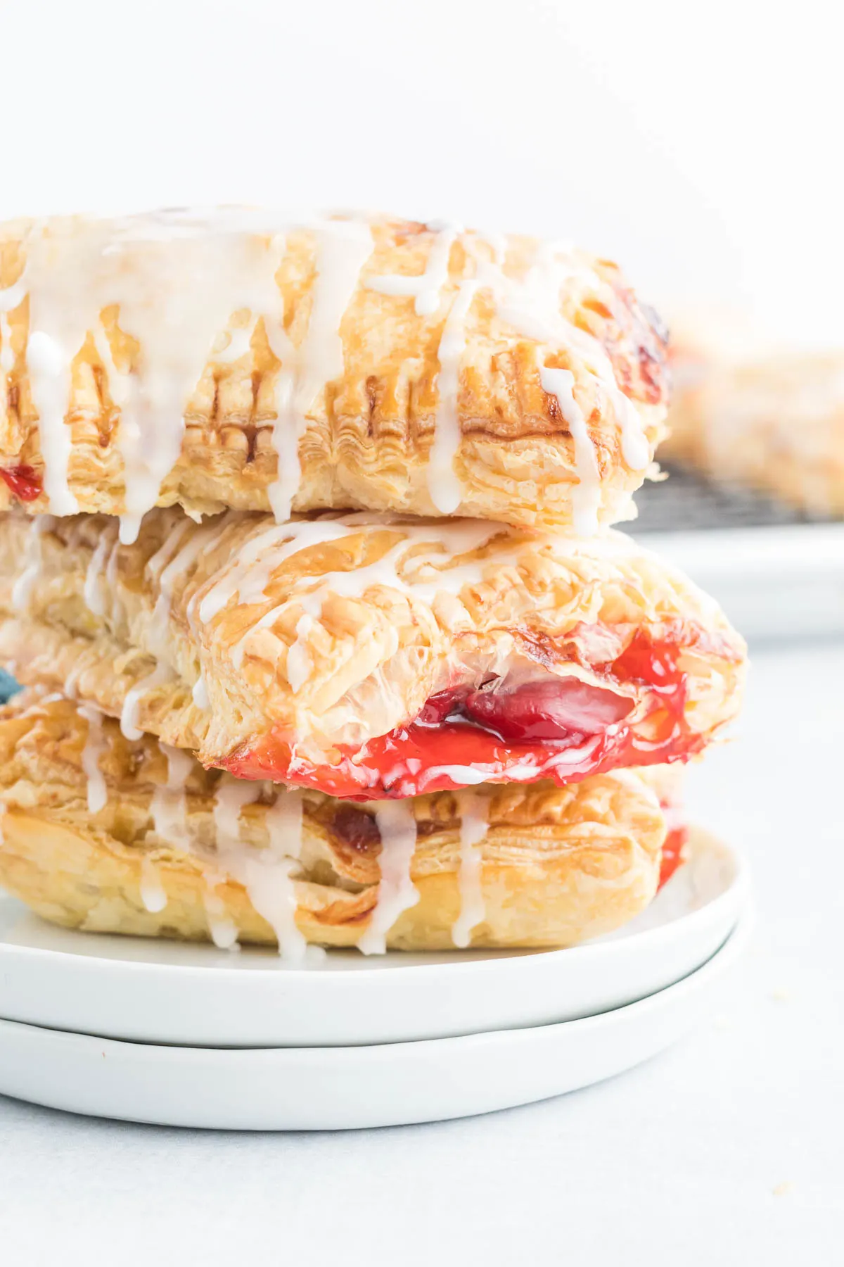 A stack of three cherry turnovers.