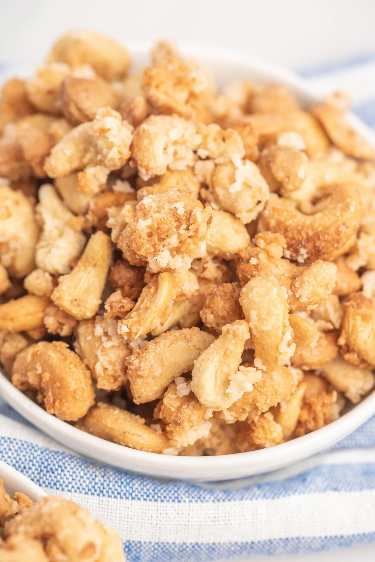 Cashews roasted with coconut and sugar to form clusters. 