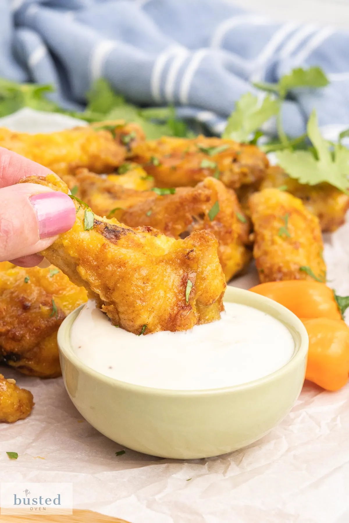 A habanero hot wing dipped in blue cheese.